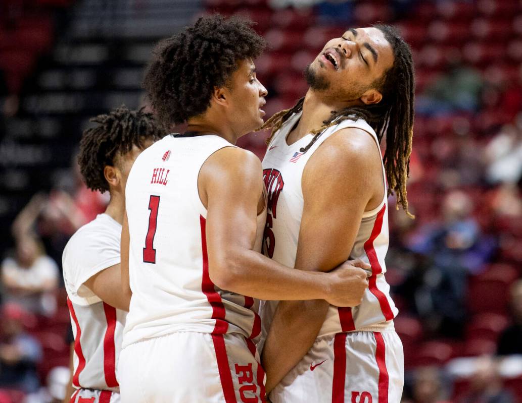 UNLV forward Jalen Hill (1) comforts forward Jeremiah Cherry, right, as Cherry receives his six ...