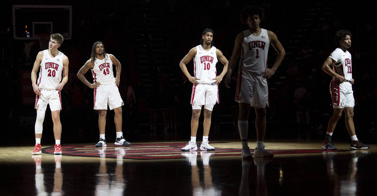 UNLV guard Julian Rishwain (20), forward Jeremiah Cherry (45), guard Jaden Henley (10), forward ...