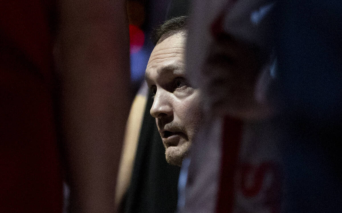 UNLV head coach Kevin Kruger talks to the team during the college basketball game against the O ...