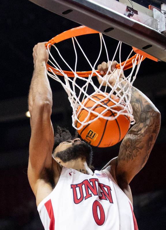 UNLV forward Isaiah Cottrell (0) dunks the ball during the college basketball game against the ...