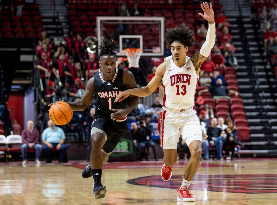 Omaha Mavericks guard JJ White (1) and UNLV guard Brooklyn Hicks (13) compete during the colleg ...