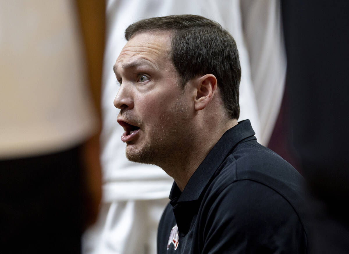 UNLV head coach Kevin Kruger yells at the team while in a time out during the college basketbal ...