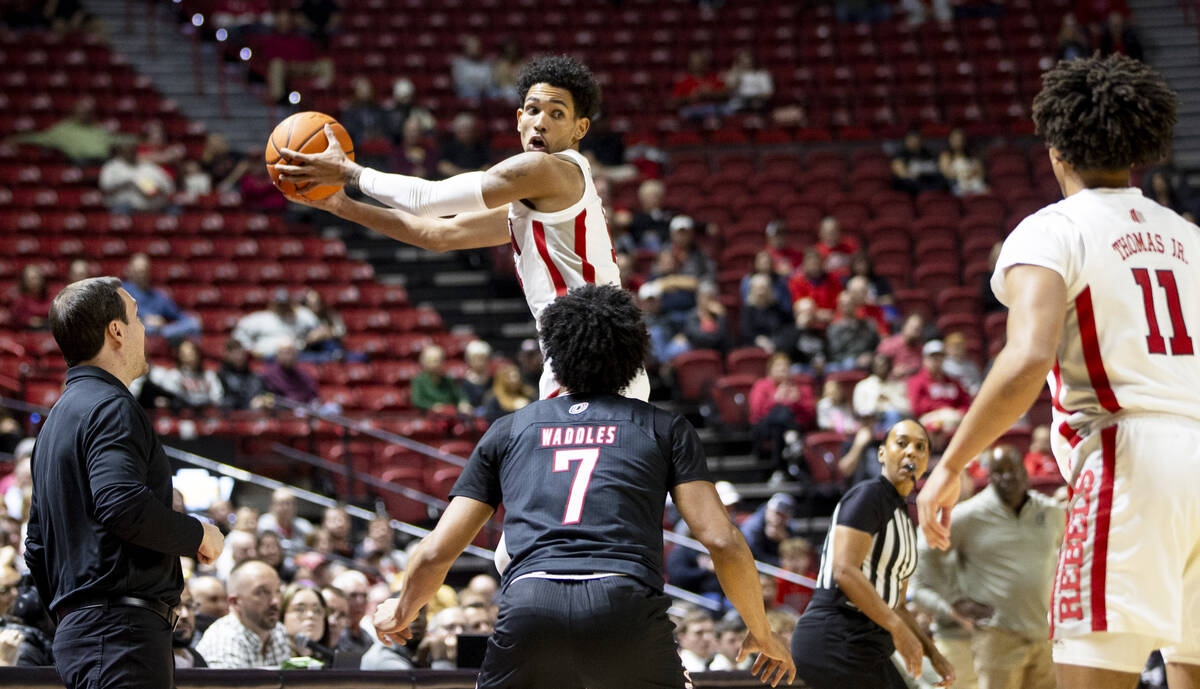 UNLV guard Jailen Bedford (14) jumps and looks to throw a loose ball back in bounds during the ...