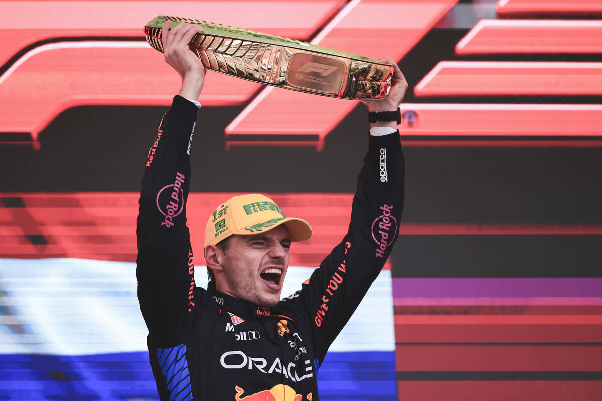 Red Bull driver Max Verstappen, of the Netherlands, celebrates on the podium his first place in ...