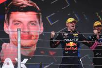 Red Bull driver Max Verstappen of the Netherlands, celebrates at the podium after winning the B ...