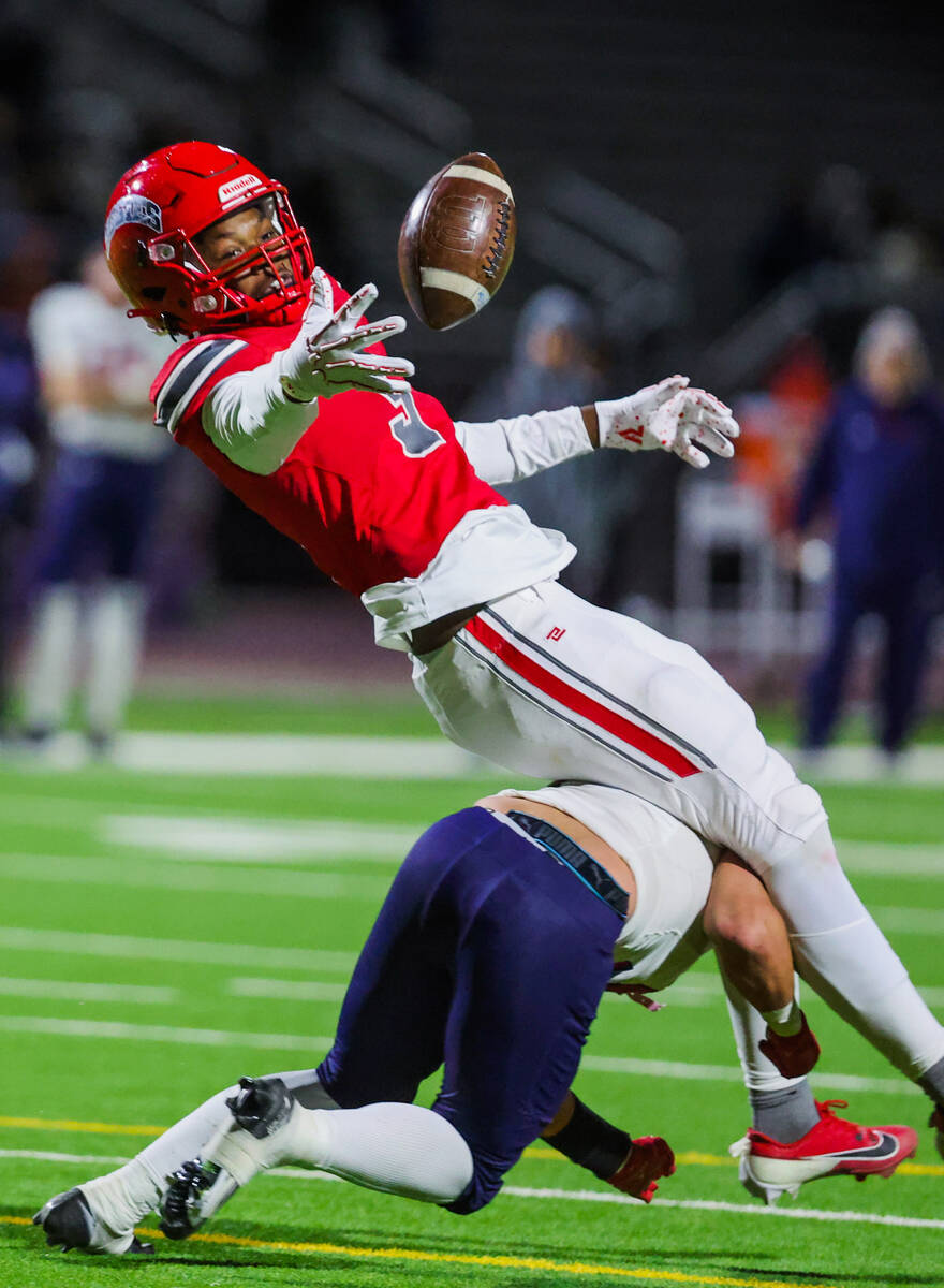 Arbor View wide receiver Damani Warren (3) misses the ball as he trips over an opposing player ...