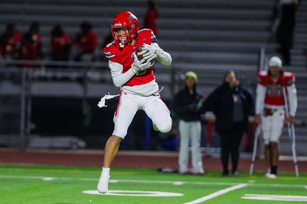 Arbor View wide receiver Kai Cypher (9) leaps as he grabs the ball during a Class 5A Division I ...