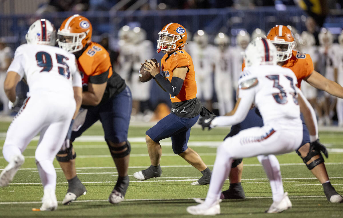 Bishop Gorman quarterback Maika Eugenio (14) looks to throw the ball during the Class 5A Divisi ...