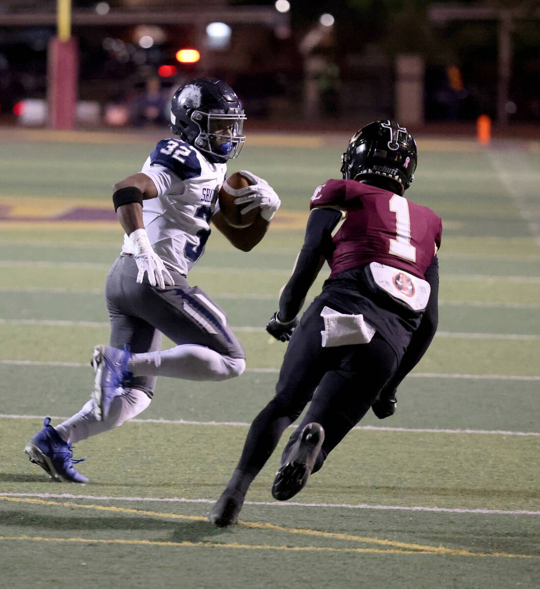 Shadow Ridge halfback Tyrell Craven (32) runs against Faith Lutheran defensive back Gavin Day ( ...