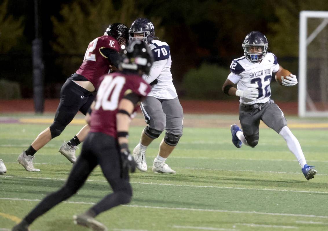 Shadow Ridge halfback Tyrell Craven (32) runs against Faith Lutheran in the fourth quarter of t ...