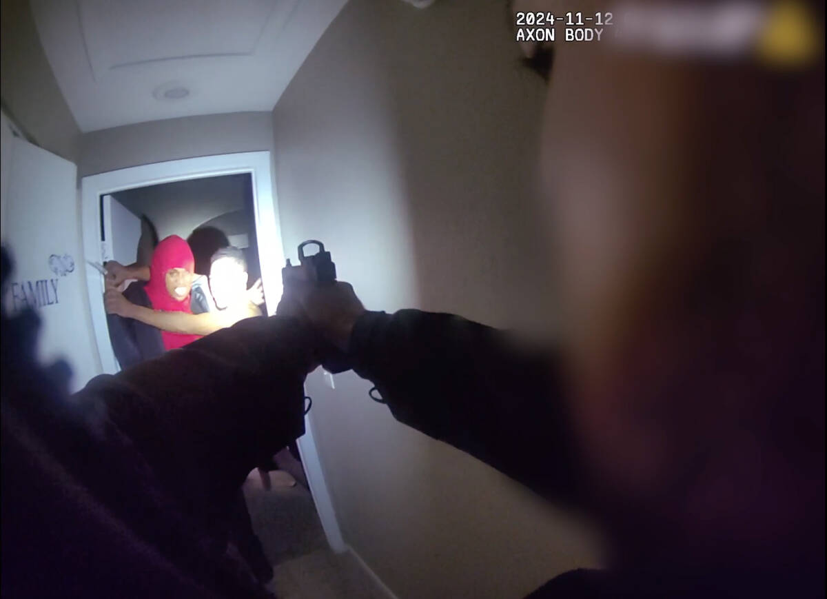 In a frame grab from a body-worn camera video provided by Metro, an intruder identified as Alej ...