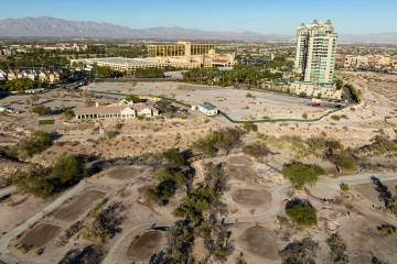 An aerial view of the shuttered Badlands Golf Course and the Queensridge towers, right, on Tues ...