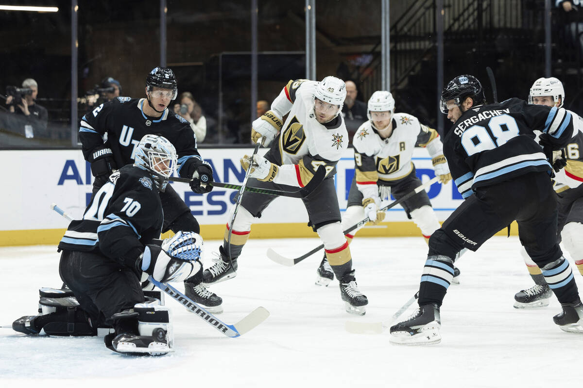 Vegas Golden Knights center Ivan Barbashev (49) shoots the puck against the Utah Hockey Club du ...