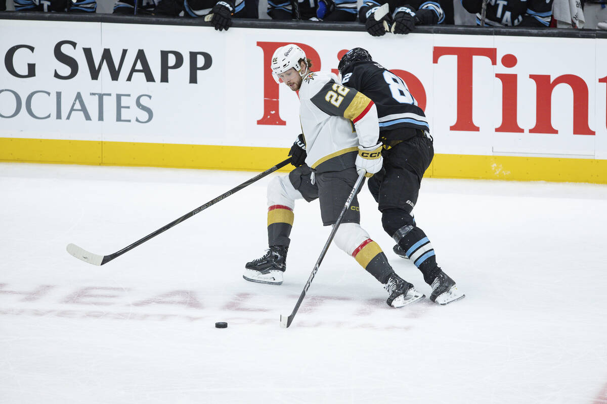 Vegas Golden Knights right wing Cole Schwindt (22) fights for the puck against Utah Hockey Club ...