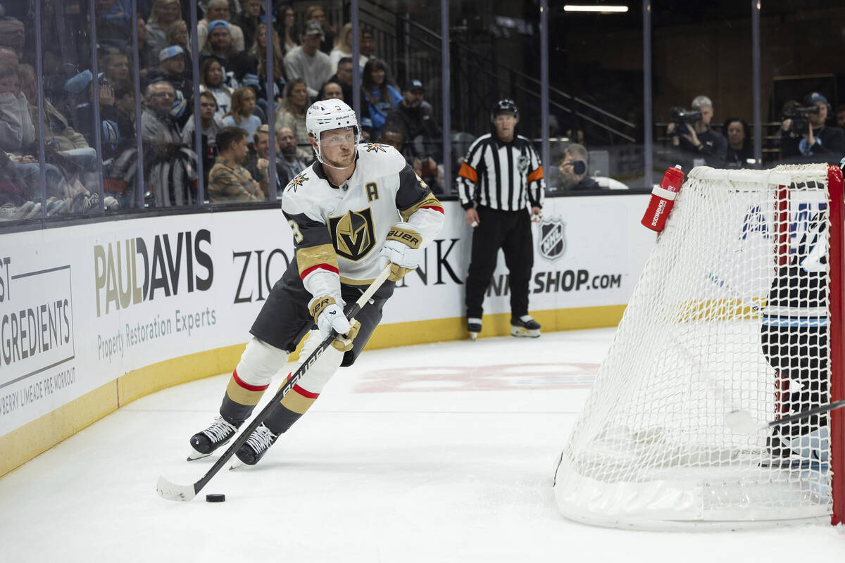 Vegas Golden Knights center Jack Eichel (9) moves the puck against the Utah Hockey Club during ...