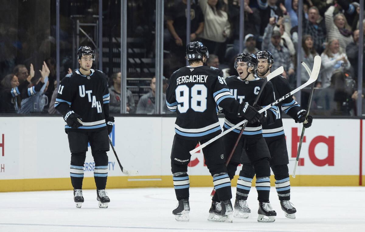 Utah Hockey Club defenseman Mikhail Sergachev (98) celebrates his goal with his teammates again ...