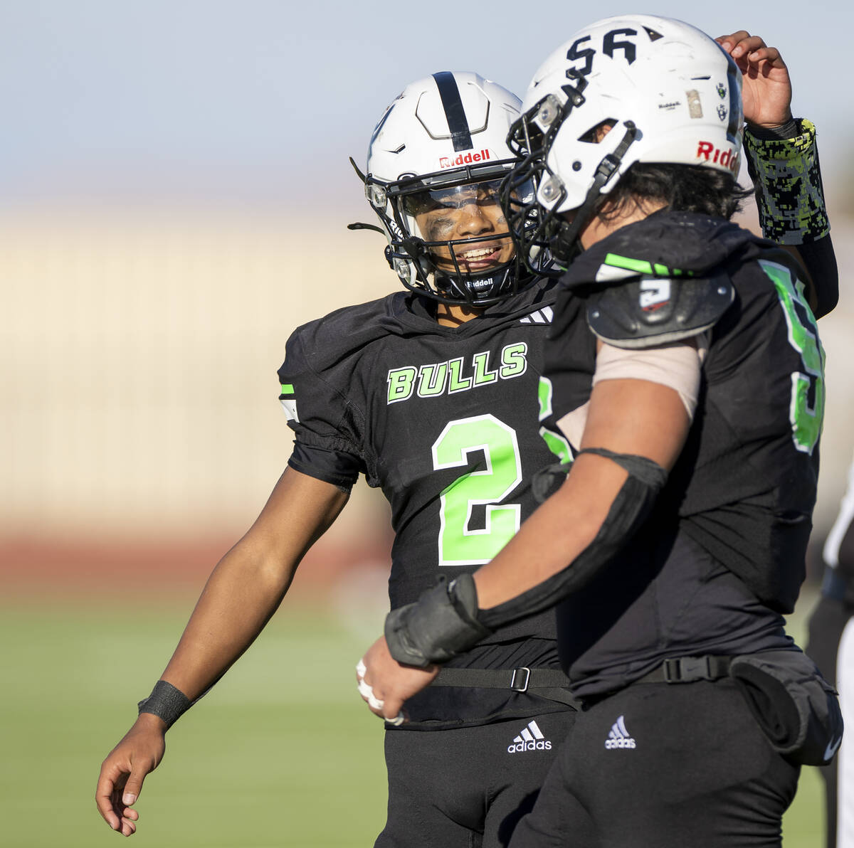 SLAM Academy junior Alaijah Young (2) and senior Chenney Chua (56) walk to the sideline togethe ...