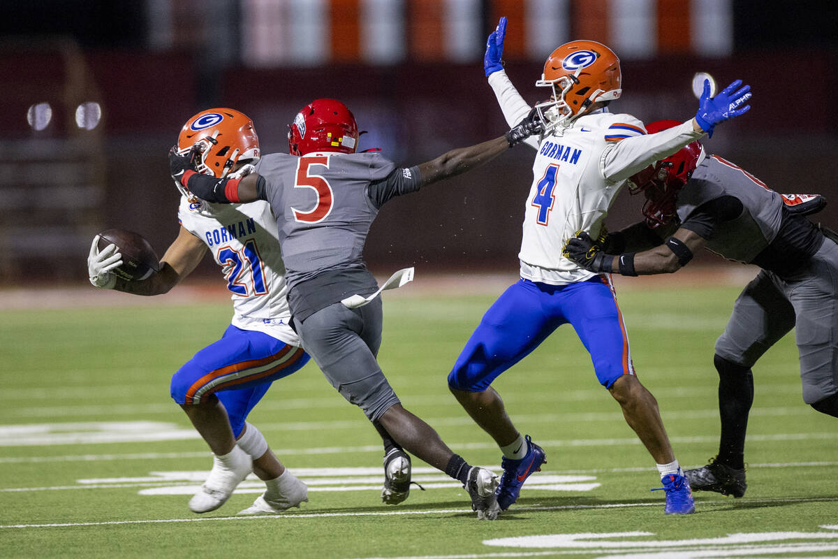 Arbor View cornerback Teddy Johnson (5) attempts to tackle Bishop Gorman running back Jonathan ...