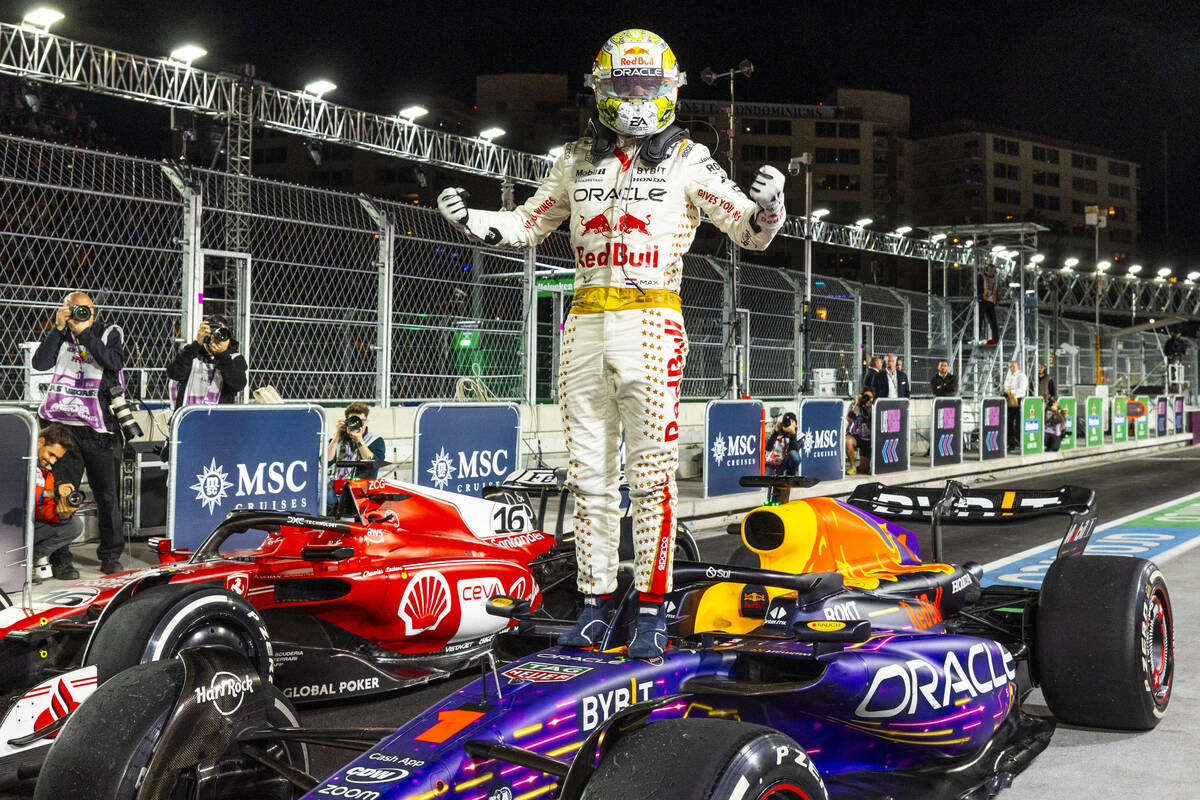 FILE - Red Bull Racing driver Max Verstappen celebrates his win atop his Red Bull Racing car fo ...