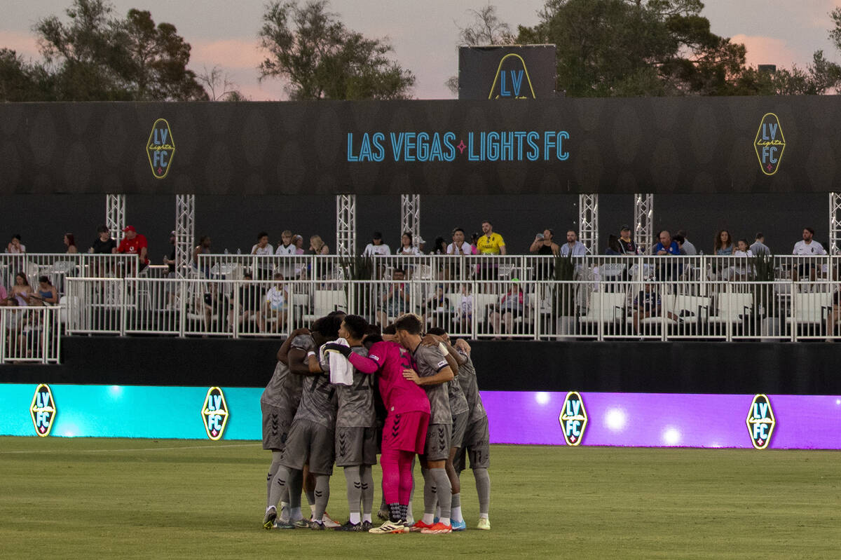 Members of the Las Vegas Lights FC huddle before a USL Championship soccer game against the Det ...