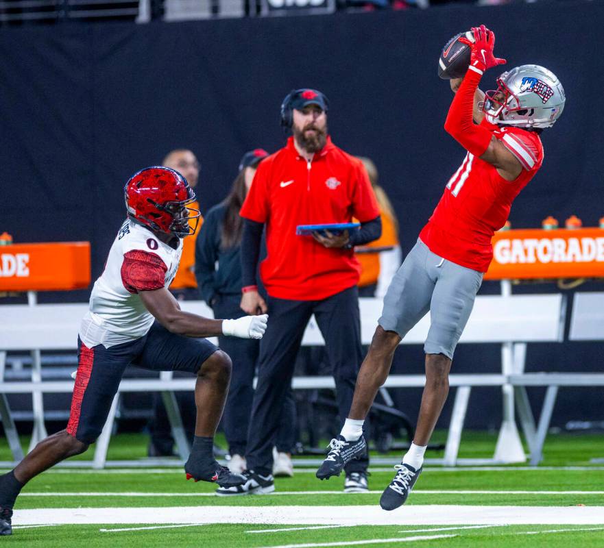 UNLV wide receiver Ricky White III (11) elevates for a long reception as San Diego State Aztecs ...