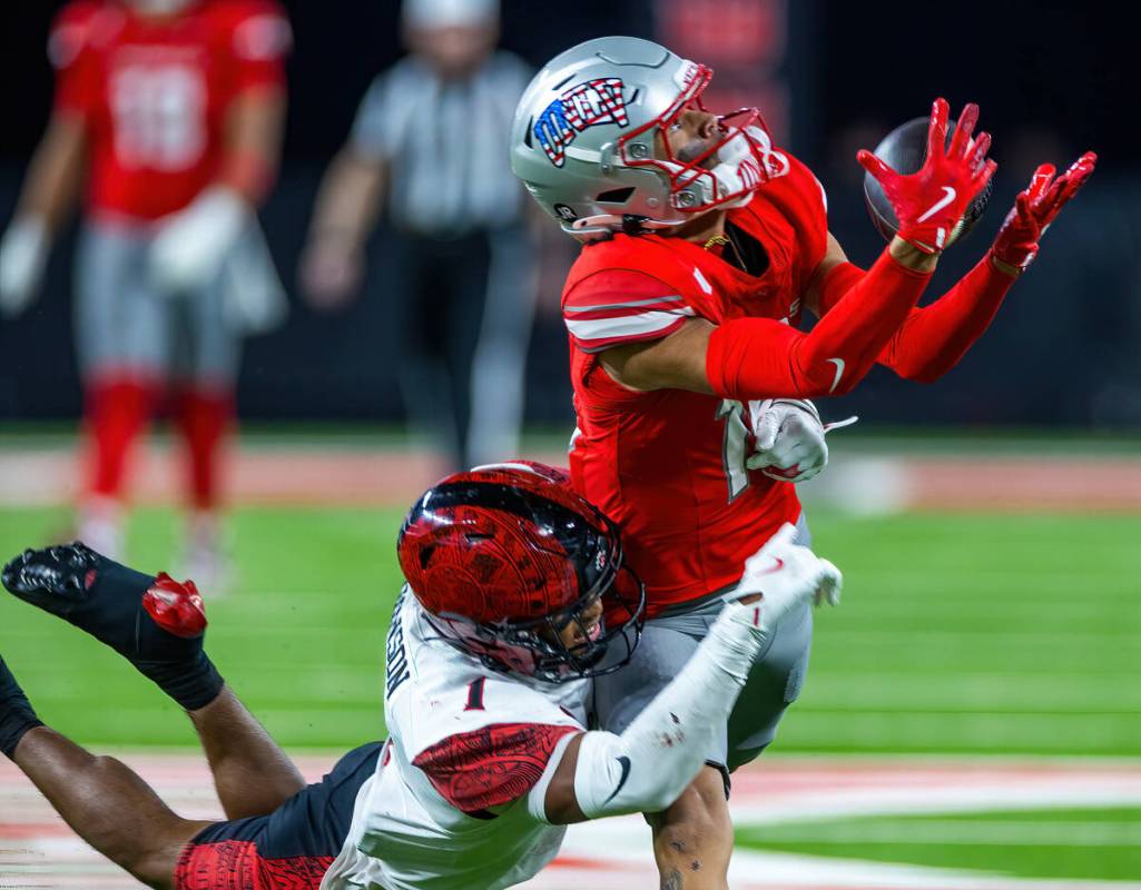 UNLV wide receiver Kayden McGee (16) races for a long pass reception as San Diego State Aztecs ...