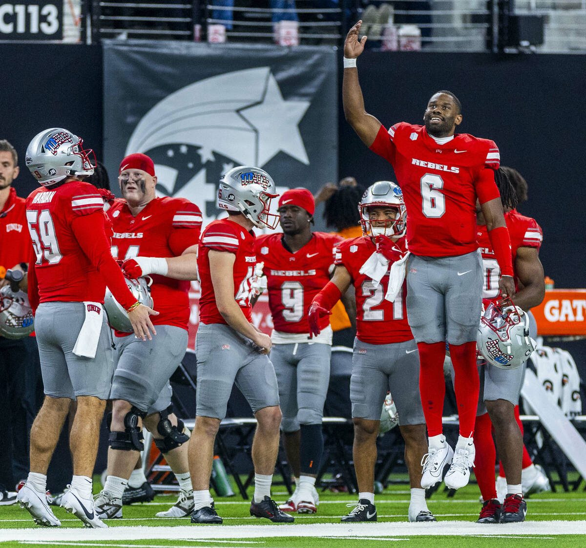 UNLV quarterback Hajj-Malik Williams (6) pumps up the defense while on the sidelines against th ...