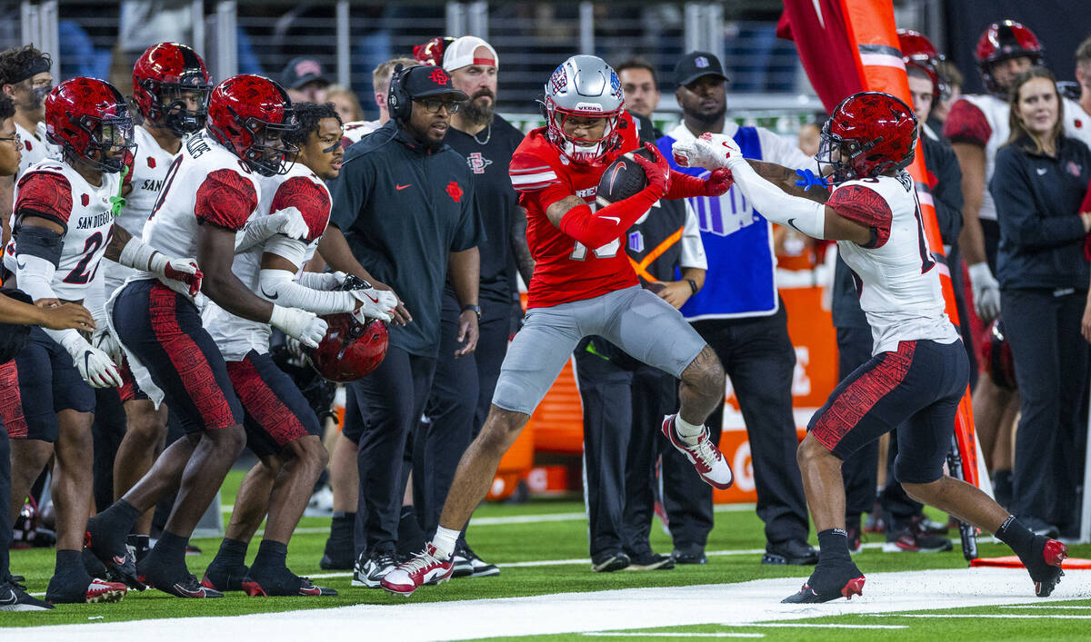 UNLV wide receiver Corey Thompson Jr. (13) is pushed out of bounds after catch by San Diego Sta ...