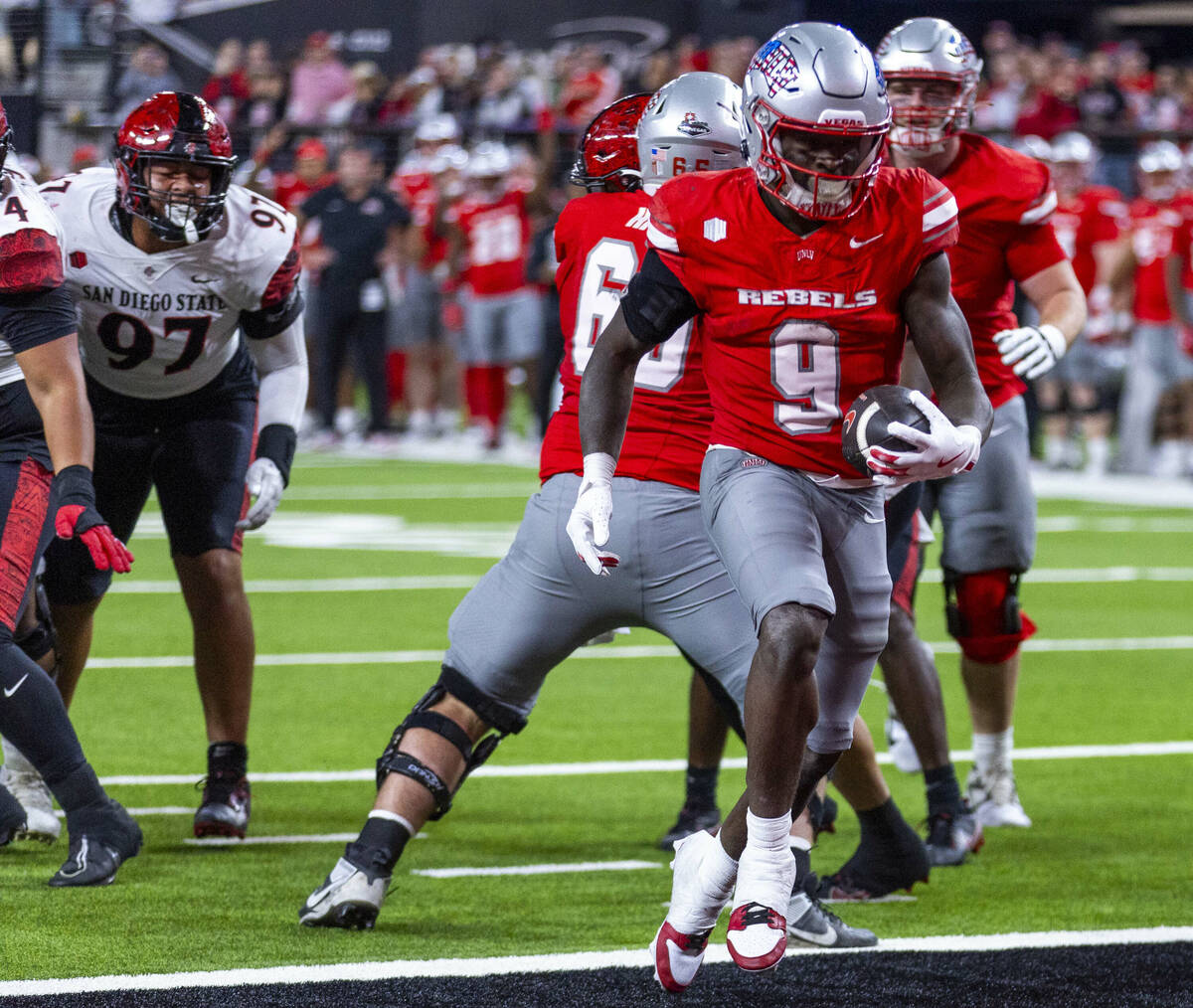 UNLV running back Jai'Den Thomas (9) scores against the San Diego State Aztecs during the first ...