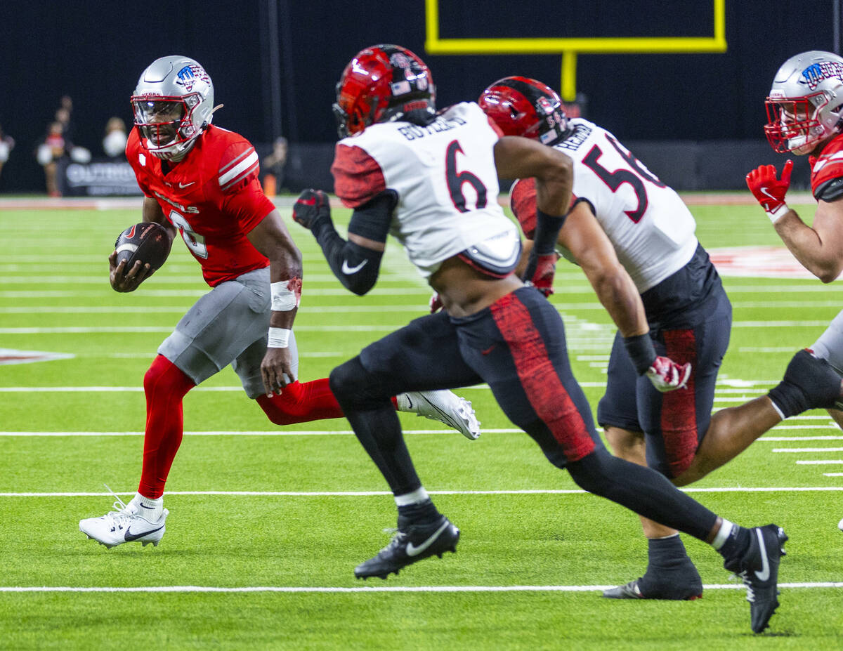 UNLV quarterback Hajj-Malik Williams (6) turns the corner looking for the end zone as San Diego ...