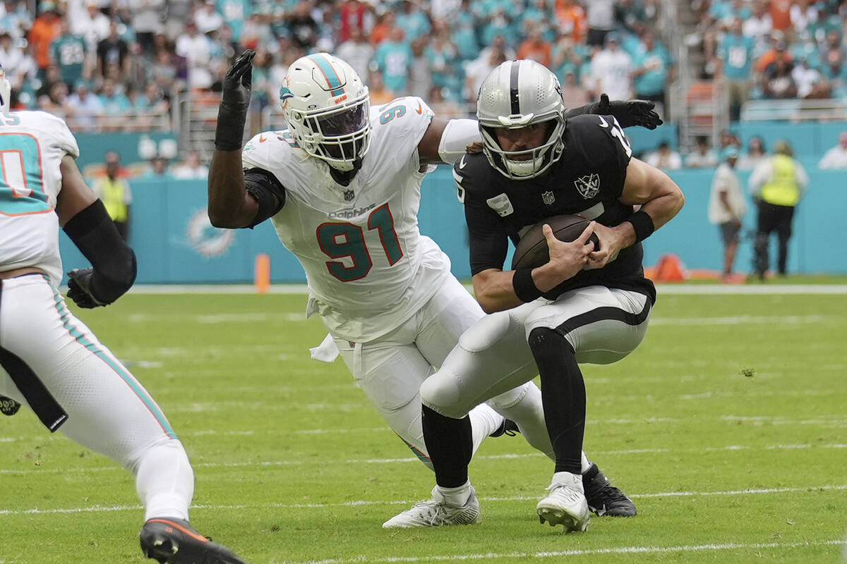 Miami Dolphins linebacker Emmanuel Ogbah (91) sacks Las Vegas Raiders quarterback Gardner Minsh ...