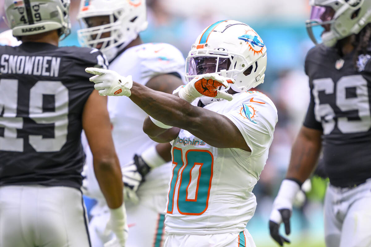 Miami Dolphins wide receiver Tyreek Hill (10) reacts as he celebrates a reception during an NFL ...