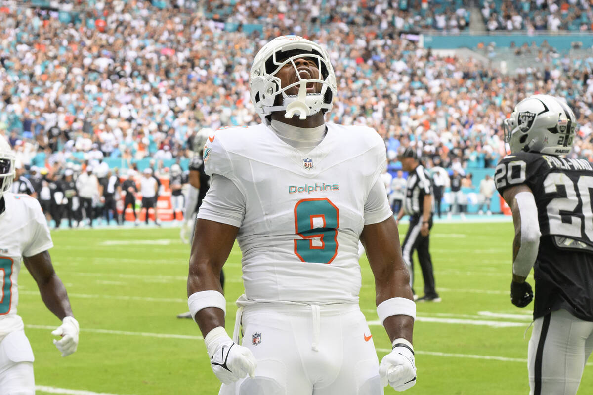 Miami Dolphins tight end Jonnu Smith (9) yells as he celebrates scoring a touchdown during an N ...