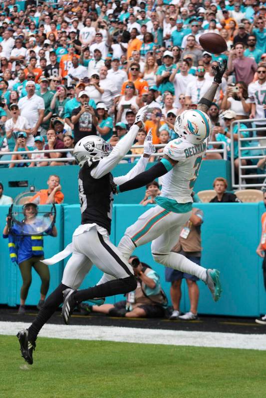 Las Vegas Raiders cornerback Jack Jones (18) defends Miami Dolphins wide receiver Odell Beckham ...