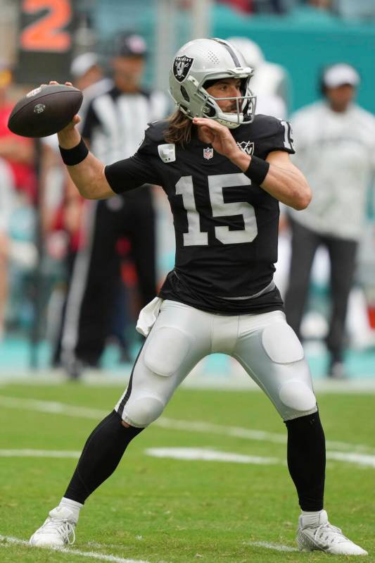 Las Vegas Raiders quarterback Gardner Minshew (15) aims a pass during the second half of an NFL ...