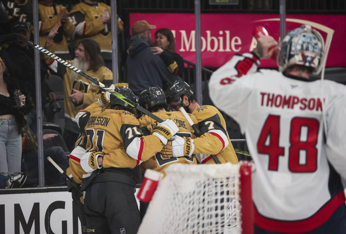 The Golden Knights celebrate after scoring against Washington Capitals goaltender Logan Thompso ...