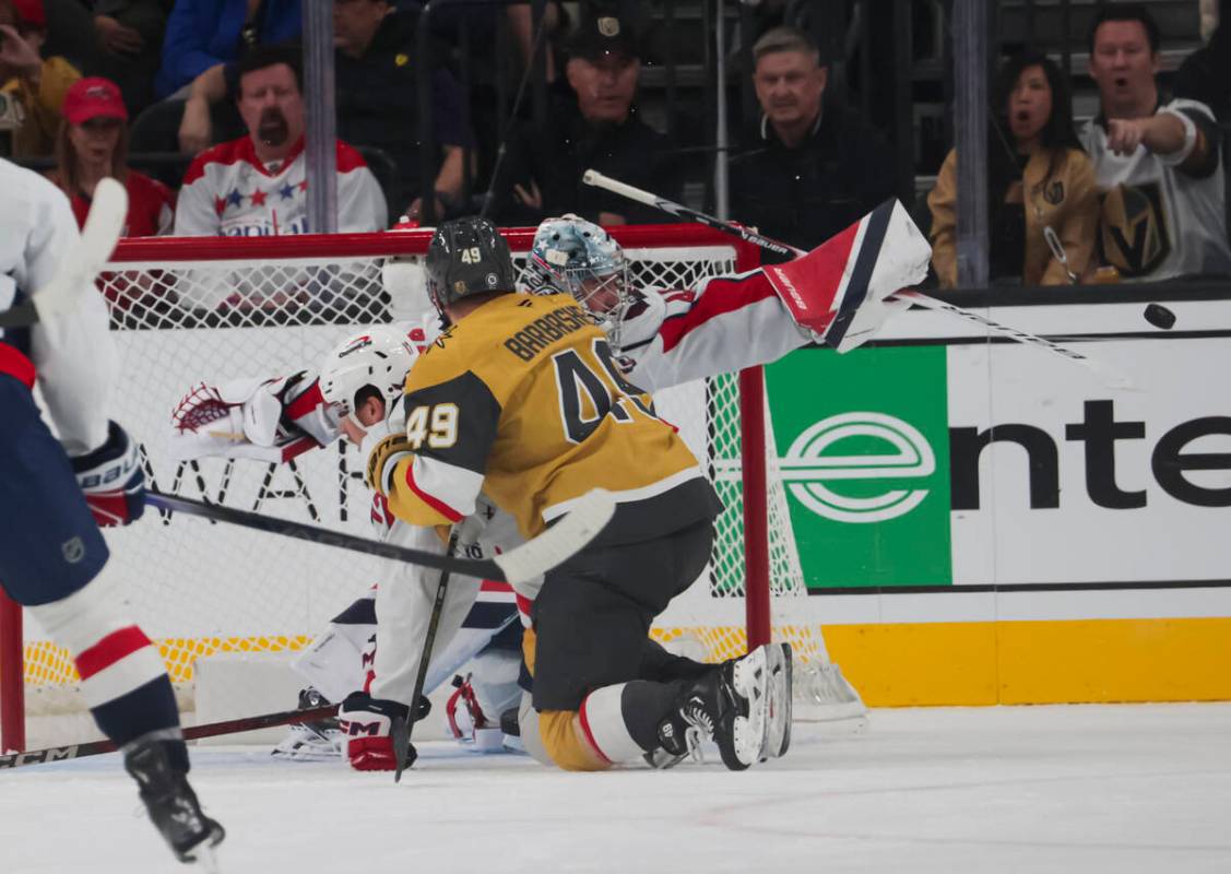 Washington Capitals goaltender Logan Thompson (48) deflects the puck in front of Golden Knights ...