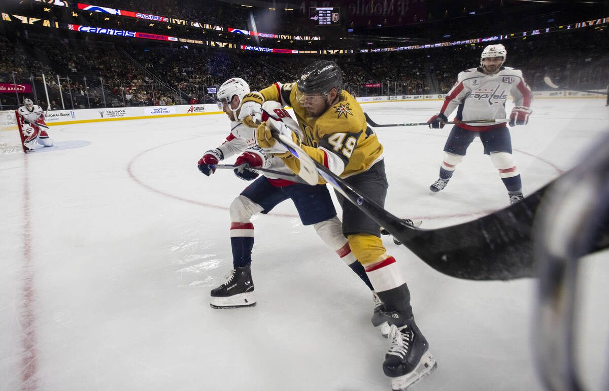 Golden Knights center Ivan Barbashev (49) and Washington Capitals left wing Pierre-Luc Dubois ( ...