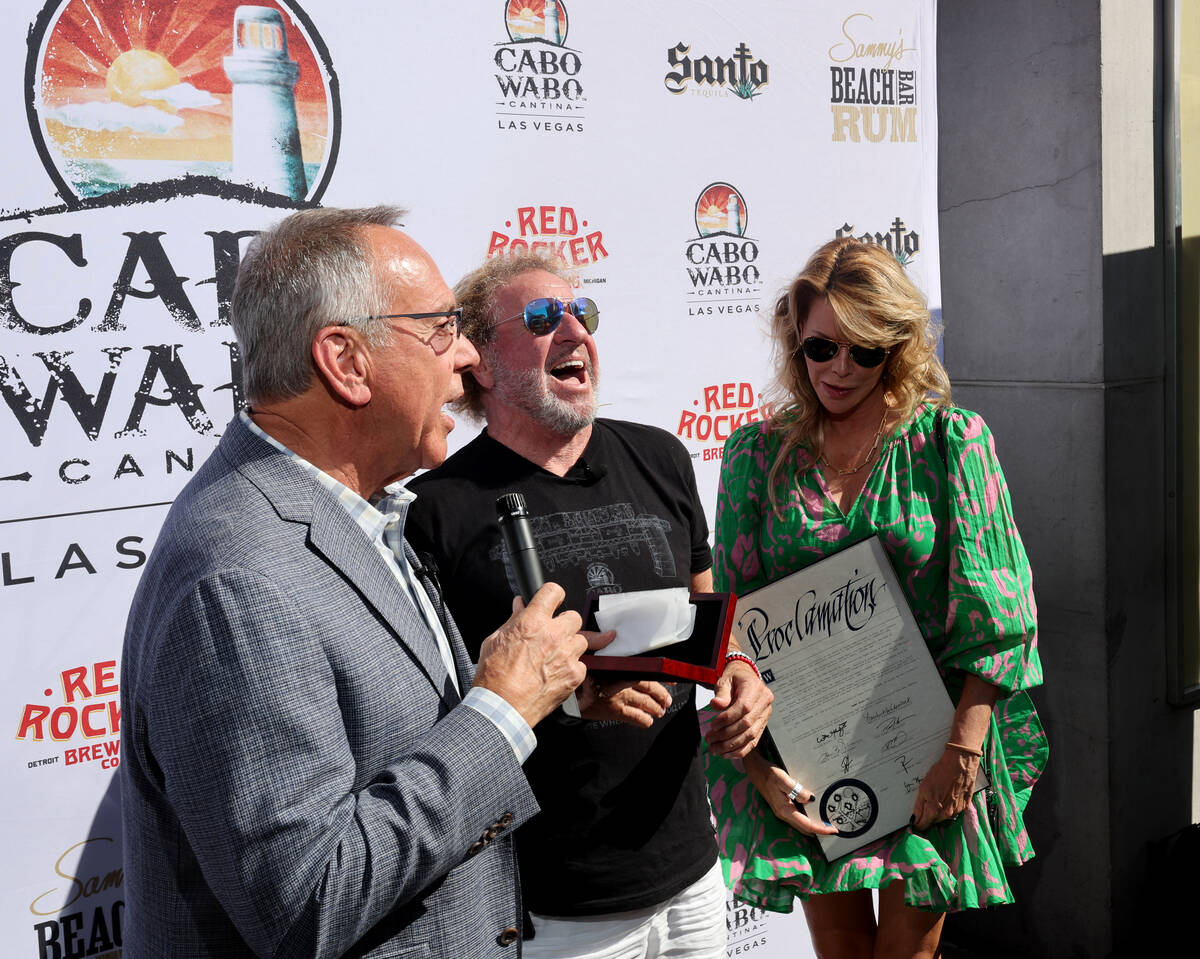 Clark County Commissioner Jim Gibson, left, gives Sammy Hagar a Key to the Las Vegas Strip as H ...