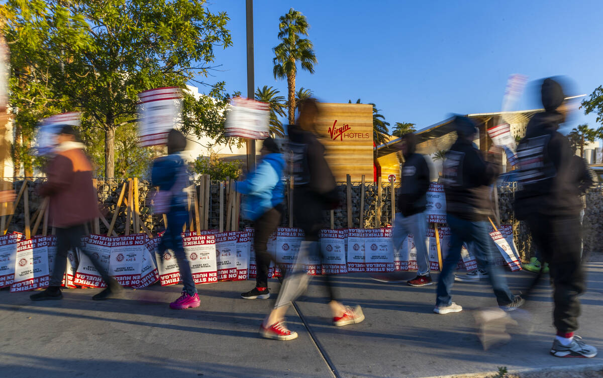 Culinary Local 226 workers on strike on the sidewalk near the main entrance outside the Virgin ...