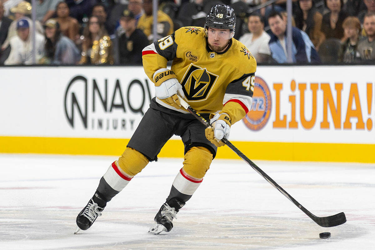 Golden Knights center Ivan Barbashev (49) controls the puck during the first period of the NHL ...