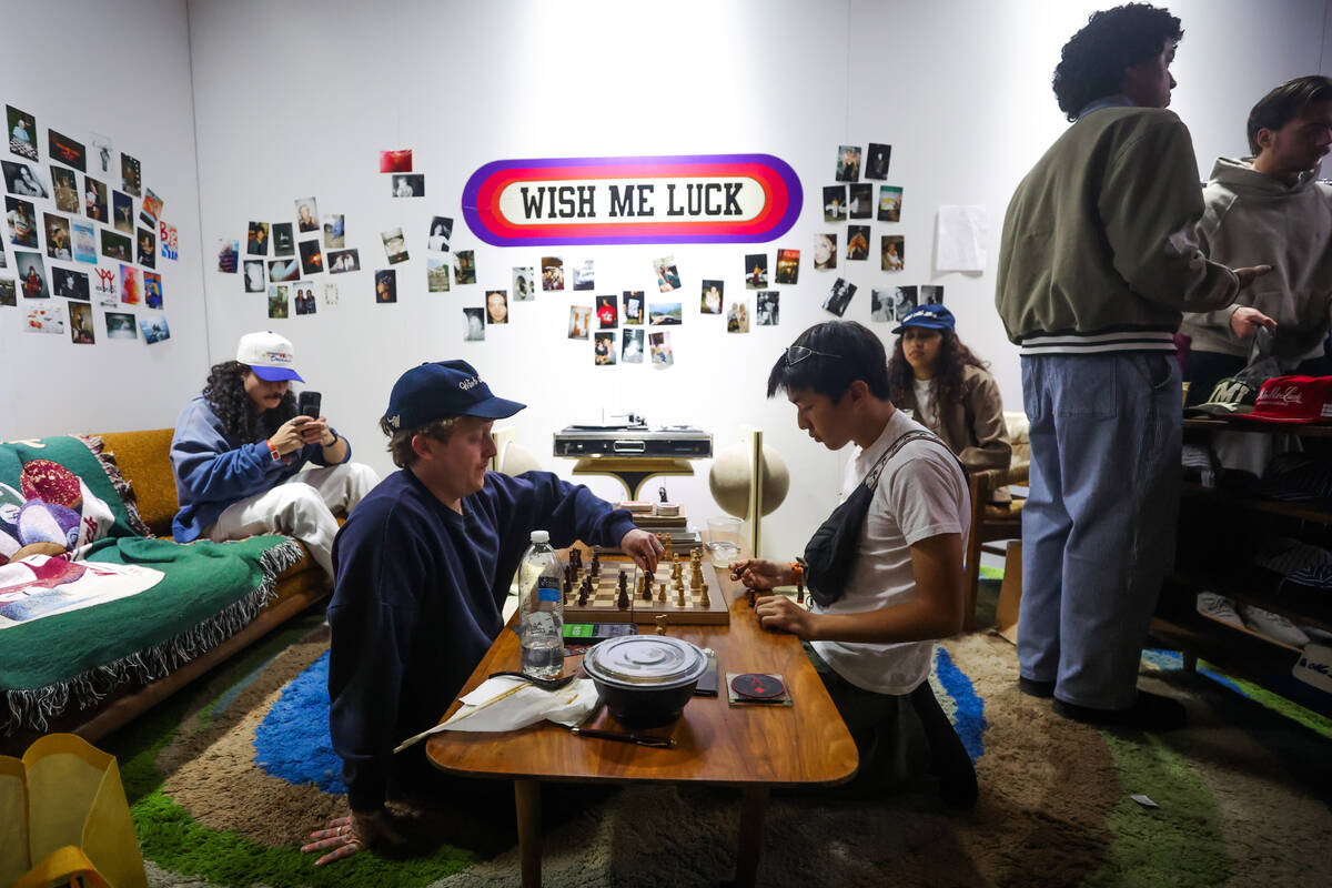 Attendees play chess at a shopping booth during ComplexCon at the Las Vegas Convention Center o ...