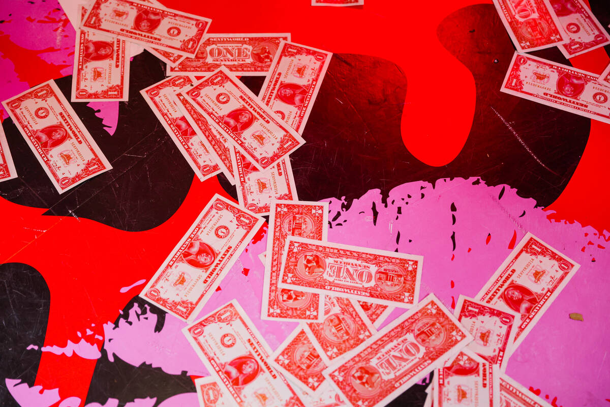 Sexyybucks, a form of fake money, lie on the floor of a booth curated by rapper Sexyy Red durin ...