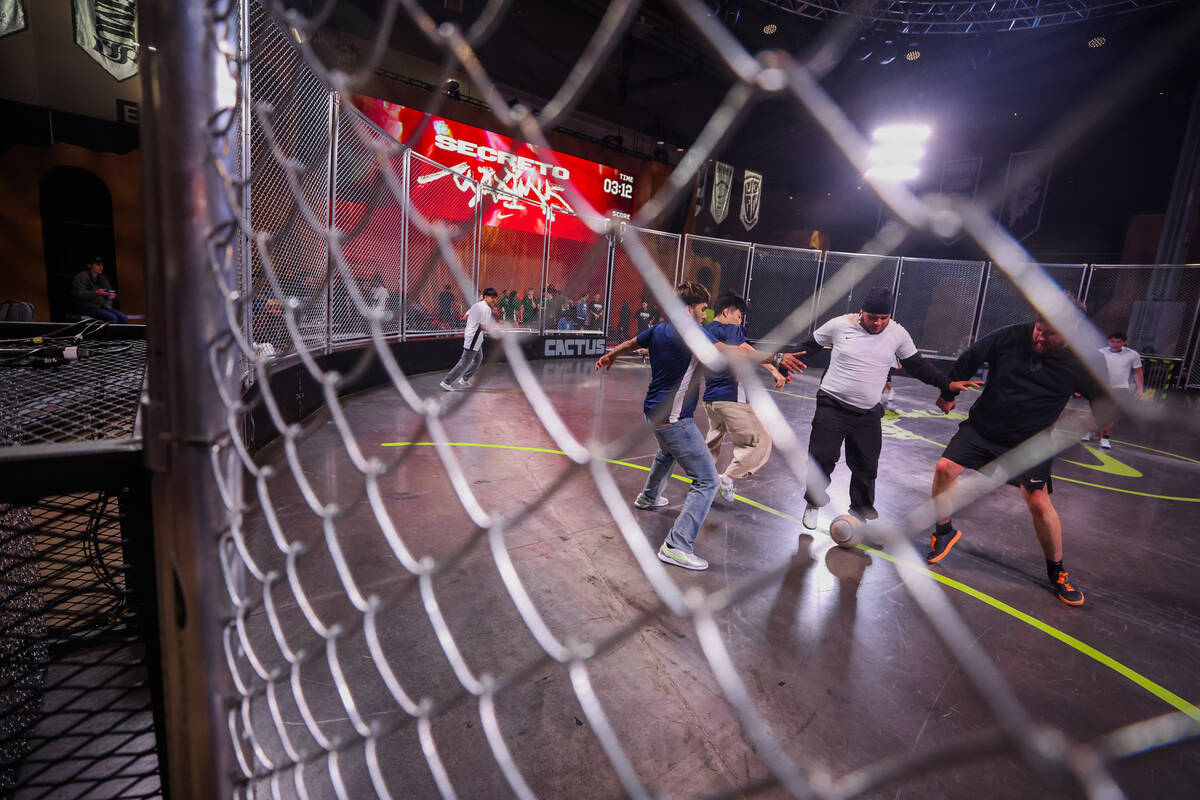 Attendees play a game of soccer inside of a Cactus Jack soccer arena, designed by Travis Scott, ...