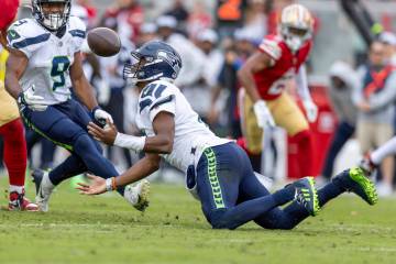 Seattle Seahawks quarterback Geno Smith (7) catches a fumbled ball against the San Francisco 49 ...