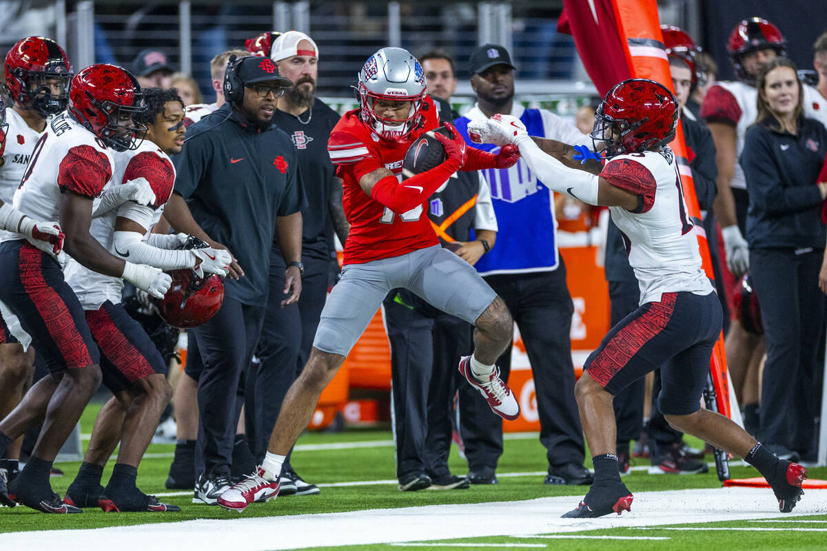 UNLV wide receiver Corey Thompson Jr. (13) is pushed out of bounds after catch by San Diego Sta ...