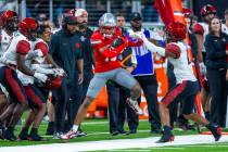 UNLV wide receiver Corey Thompson Jr. (13) is pushed out of bounds after catch by San Diego Sta ...