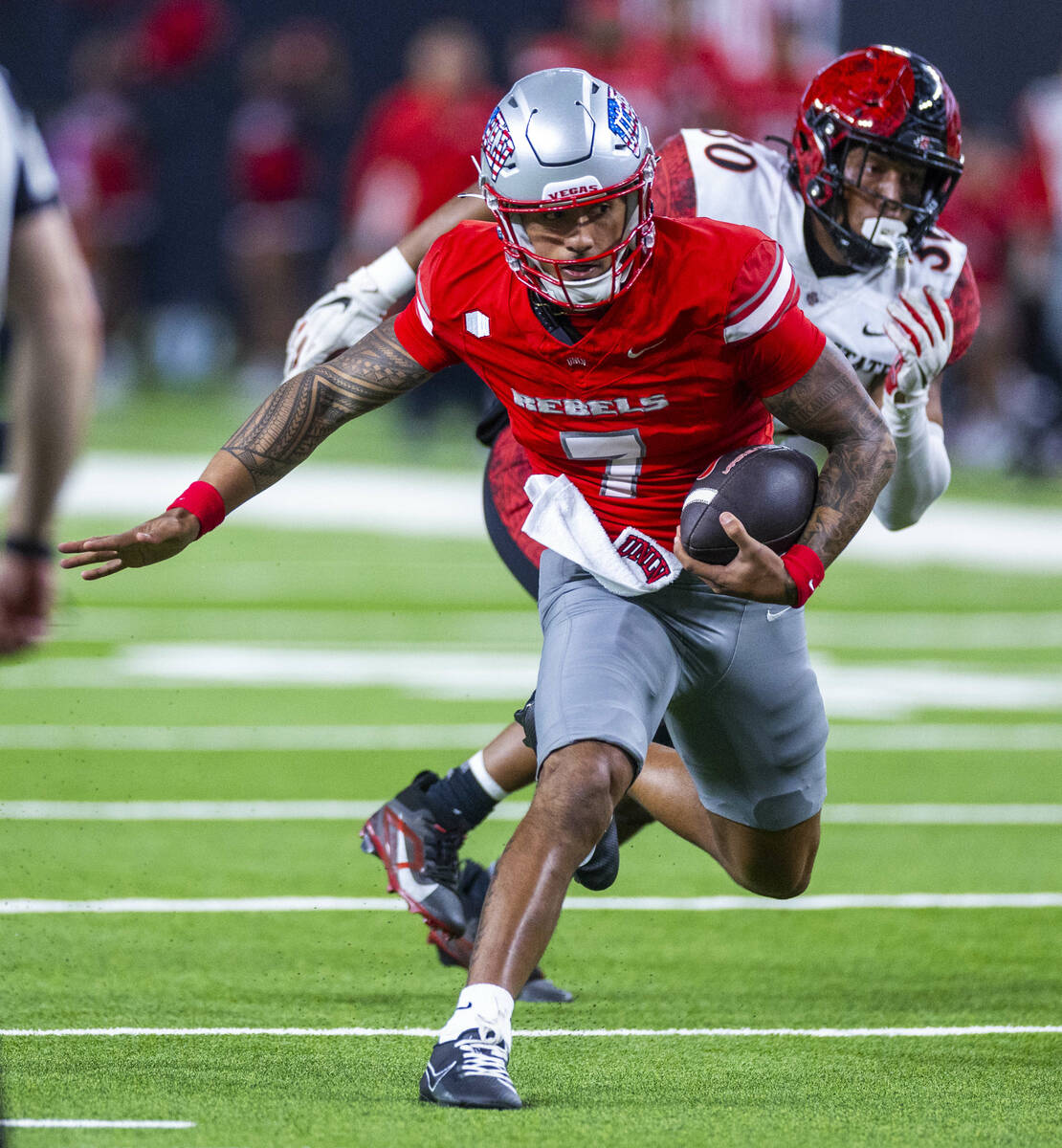 UNLV quarterback Cameron Friel (7) heads towards the end zone but is stopped short by the San D ...