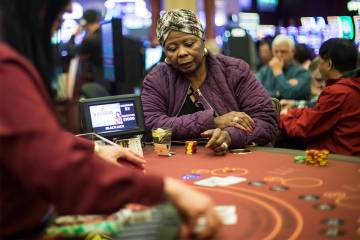 FILE - Barbara Wright, of Las Vegas, plays blackjack at Rampart Casino in Las Vegas, Sunday, Ma ...