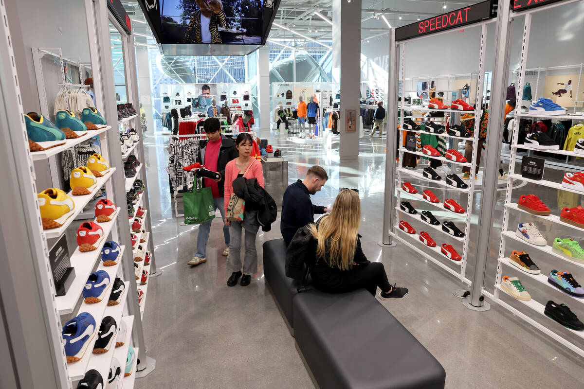 Kim Bugeon and Oh Jiyeon of South Korea shop at PUMA on the Strip in Las Vegas is shown Thursda ...